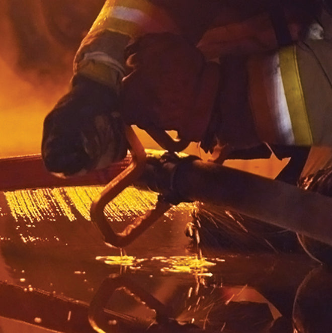 Motis Snagger Tool being used as a spanner wrench on firefighting hose